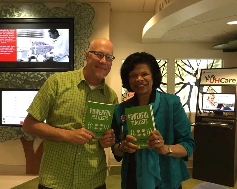Kris Koch and Dr. Deforia Lane holding copies of Powerful Playlists