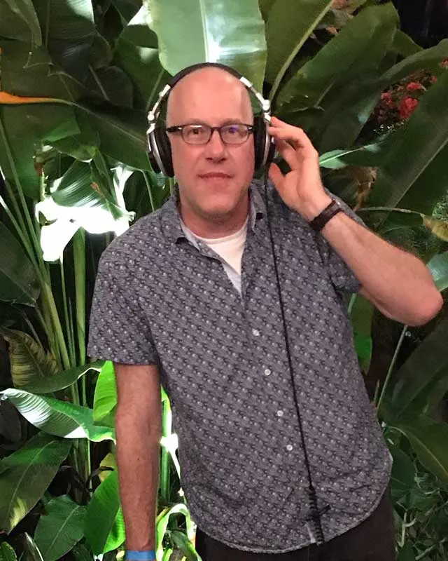 Kris Koch wearing DJ headphones